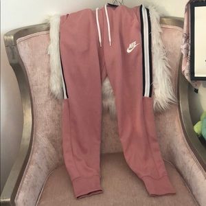 Nike jogging pants rose colored.